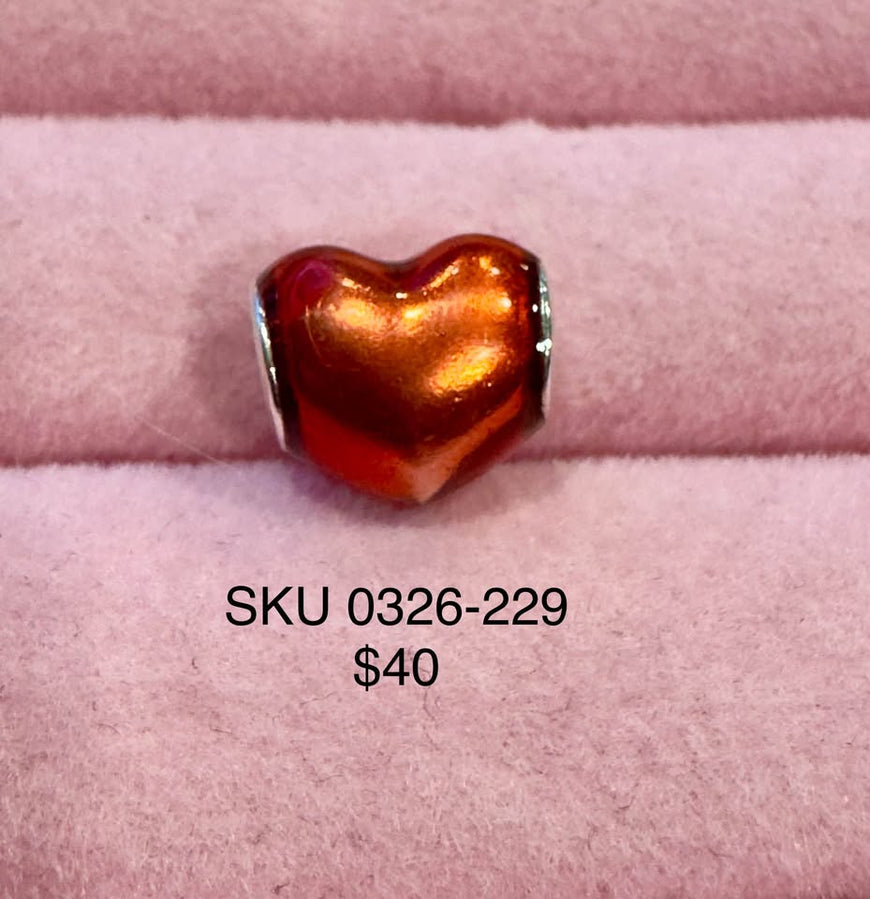 Iridescent orange heart charm bead