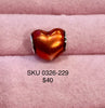 Iridescent orange heart charm bead