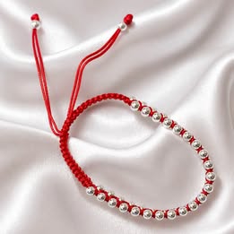 Pulso trensado con bolitas de plata color rojo, azul, o negro