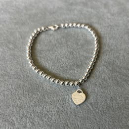 PULSERA DE BOLITAS CON DIJE CORAZON, PLATA .925