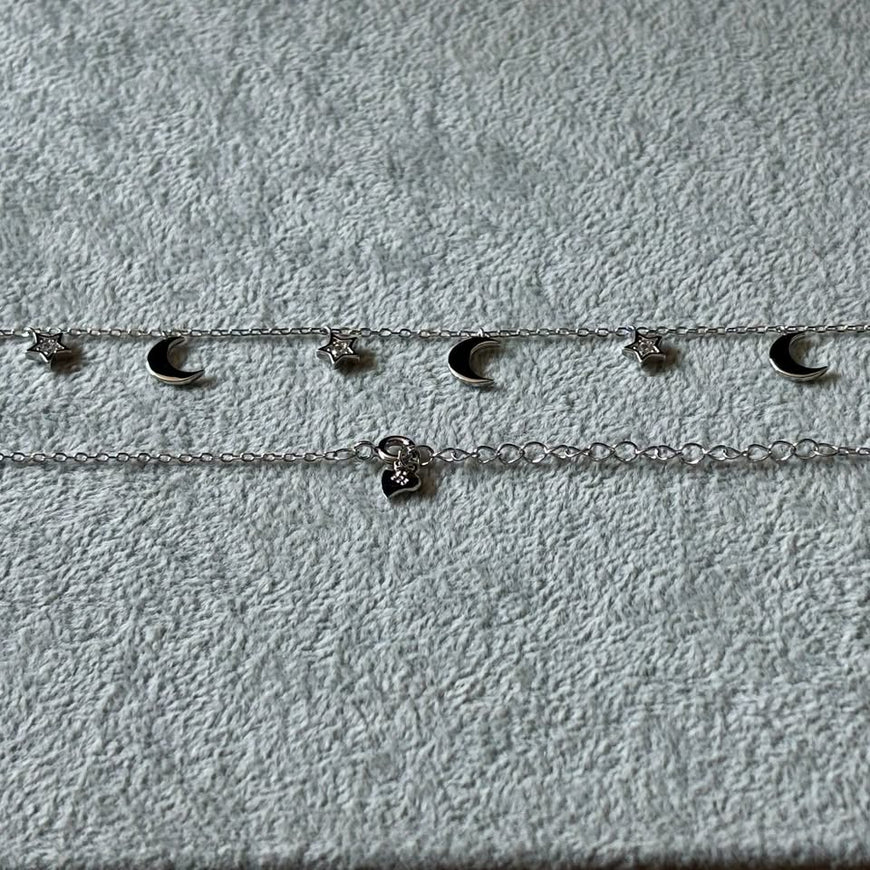 Collar con multidijes lunas y estrellas con bano de rodio
