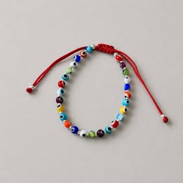 PULSERA AJUSTABLE HILO ROJO CON MULTIOJOS DE COLORES, PLATA .925