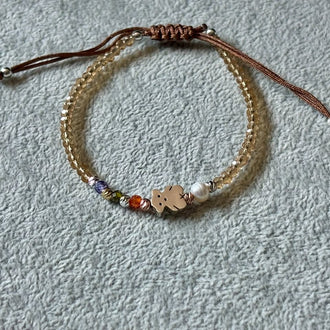 PULSERA AJUSTABLE HILO CAFE CON DIJE INSP. TOUS, PLATA .925