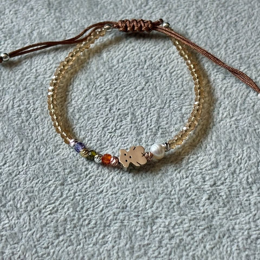 PULSERA AJUSTABLE HILO CAFE CON DIJE INSP. TOUS, PLATA .925