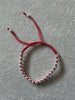Pulsera Roja con diseno de bola plata .925 hecha con hilo