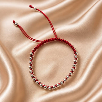Pulsera Roja con diseno de bola plata .925 hecha con hilo