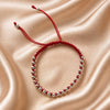Pulsera Roja con diseno de bola plata .925 hecha con hilo
