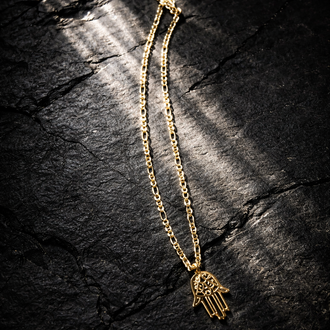 Gold necklace with charm