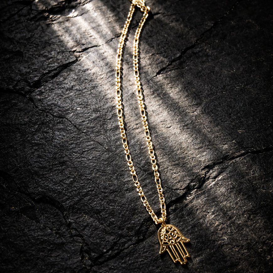 Gold necklace with charm