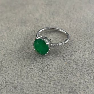 ANILLO CON PIEDRA PARAIBA REDONDA CON CIRCONIAS, TALLA 7 CON BANO DE RODIO