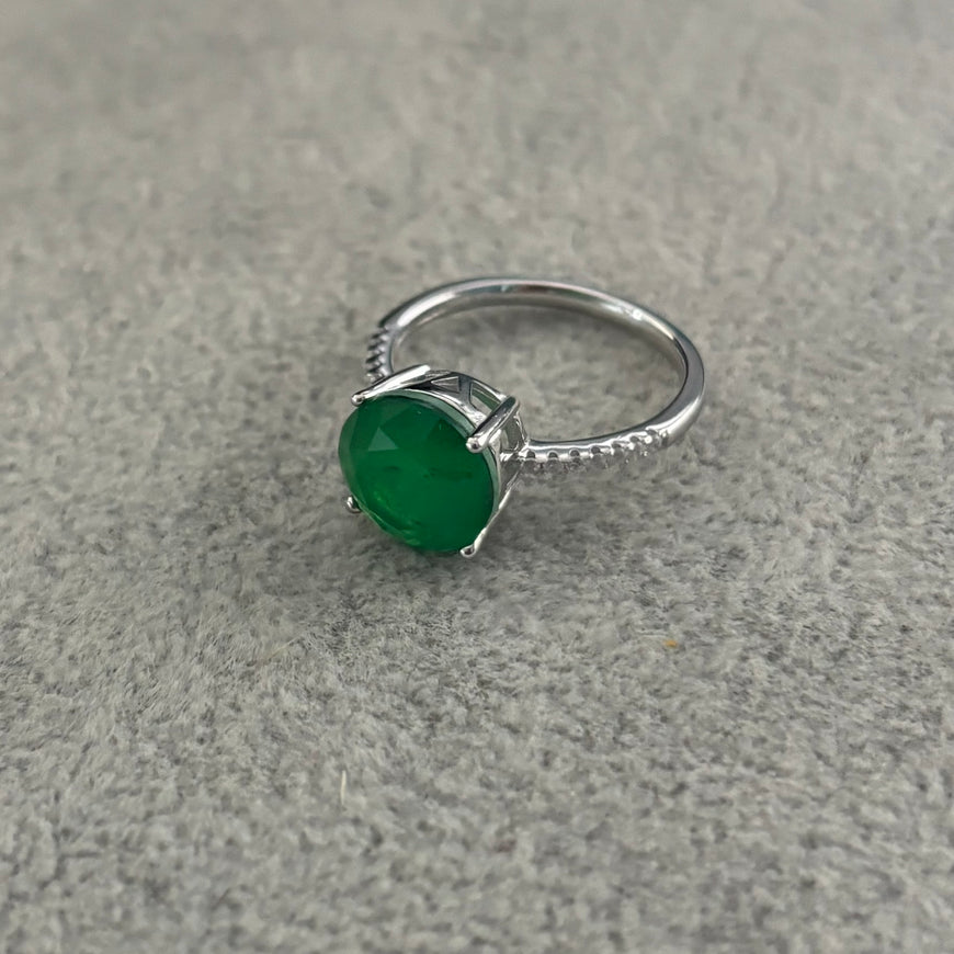 ANILLO CON PIEDRA PARAIBA REDONDA CON CIRCONIAS, TALLA 7 CON BANO DE RODIO