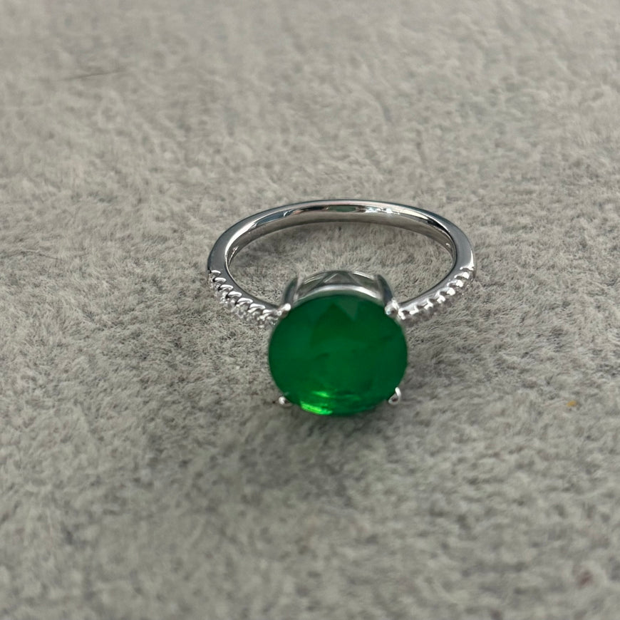 ANILLO CON PIEDRA PARAIBA REDONDA CON CIRCONIAS, TALLA 7 CON BANO DE RODIO