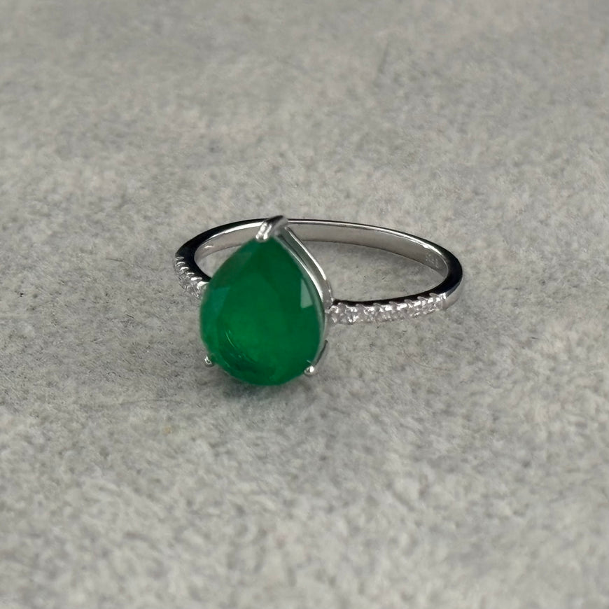 ANILLO CON PIEDRA PARAIBA GOTA DISENO AL AZAR, ELIGEN TALLA 5,6,7,8,9, CON BANO DE RODIO