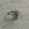 ANILLO CON CIRCONIAS BLANCAS Y DISENO LILA 7,8,9