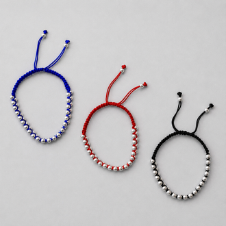 Pulso trensado con bolitas de plata color rojo, azul, o negro