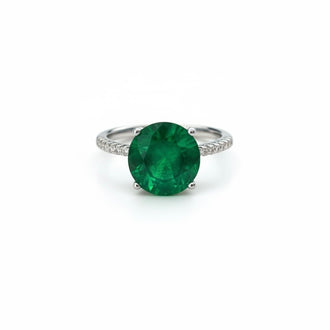 ANILLO CON PIEDRA PARAIBA REDONDA CON CIRCONIAS, TALLA 7 CON BANO DE RODIO