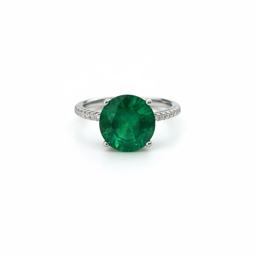 ANILLO CON PIEDRA PARAIBA REDONDA CON CIRCONIAS, TALLA 7 CON BANO DE RODIO